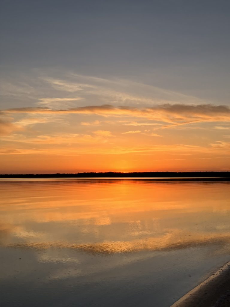 sunset on the lake at sandbanks provincial park ontario