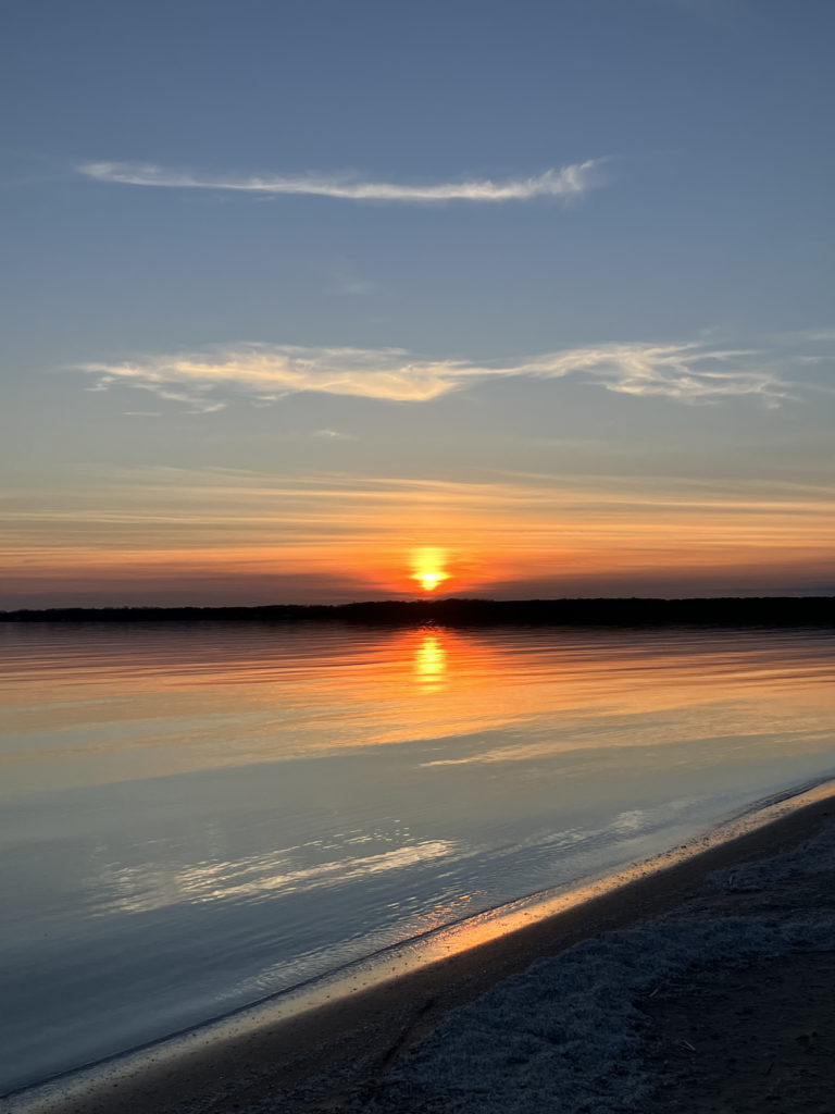 sunset on the lake at sandbanks provincial park ontario